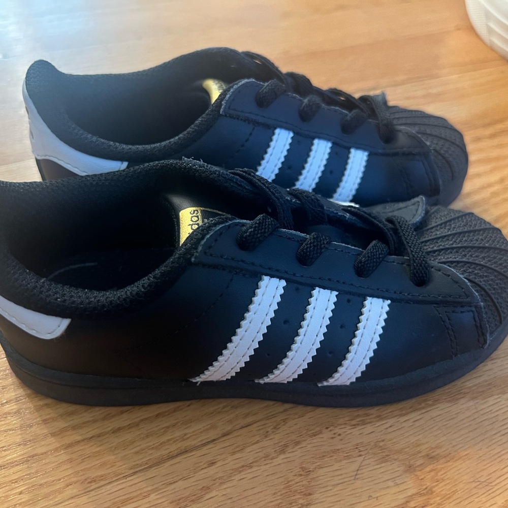 Adidas Black and White Sneakers with Iconic Shell Toe